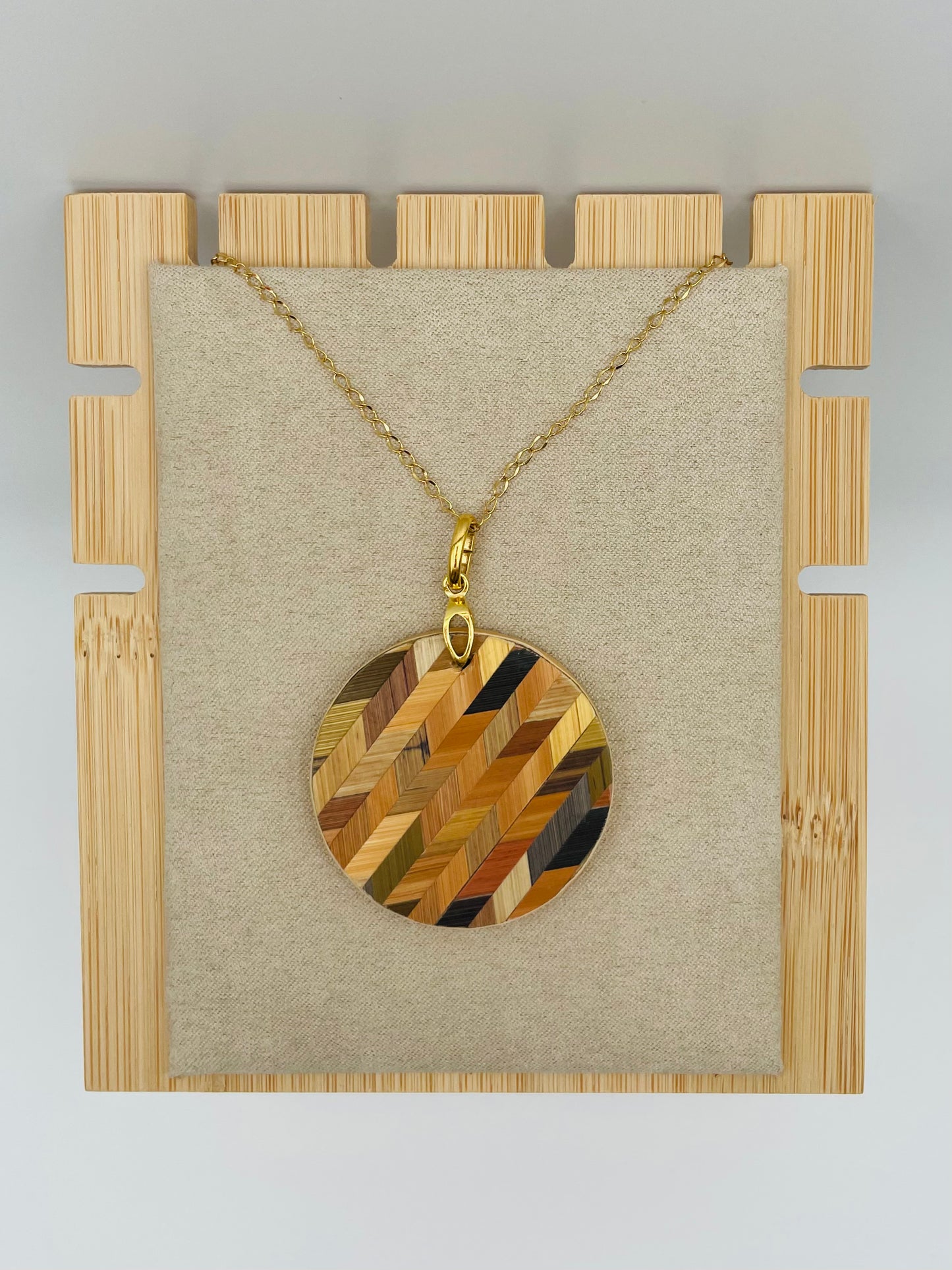 Pendentif rond chevron